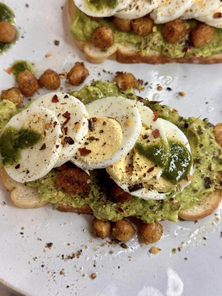 outstanding avocado toast with chickpeas and eggs.